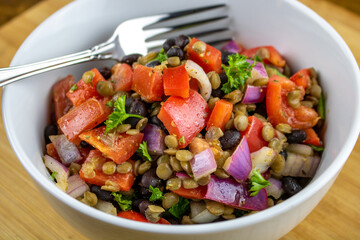 A black bean and lentil salad with cumin vinaigrette.