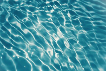 Defocus blurred transparent blue colored clear calm water surface texture with splashes and bubbles. Trendy abstract nature background. Water waves in sunlight with copy space. Blue water shine