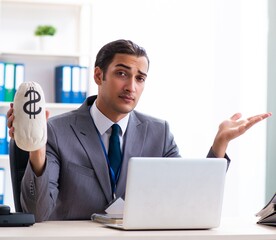 Young male accountant working in the office