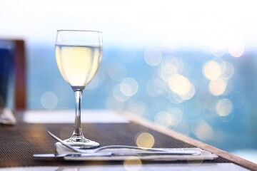 white wine tasting, chilled ice wine in a cold glass in summer
