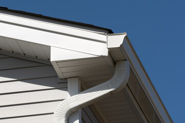 colonial white gutter guard system, fascia, drip edge, soffit providing ventilation to the attic