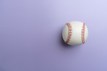baseball on purple or violet background, top view sport concept