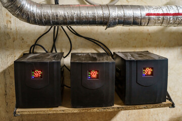 Voltage stabilizer. Three stabilizers in the basement.