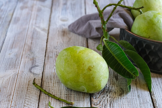 mangga arum manis or mango on a wooden table