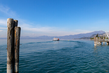 Fototapeta premium Bardolino, Lake Garda, Italy - 29 March 2023 Ferry departures from port and harbour of Bardolino