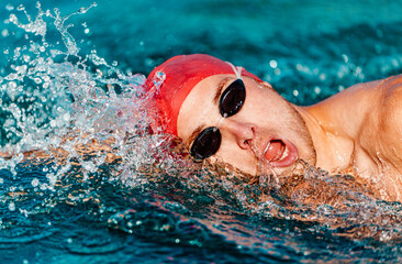 Swimming. Man swimming crawl. Male freestyle swimmer crawling doing crawl-swimming stroke in pool...