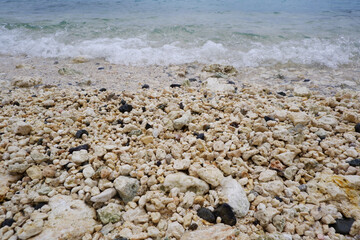 Sandy beach and natural blue ocean wave. Seaside wave closed up view.