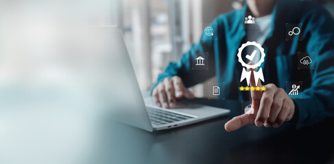 Businessman working on computer and showing the sign top Quality Assurance Standard Assurance ISO Certification and Standards Concept Satisfaction with products and services.