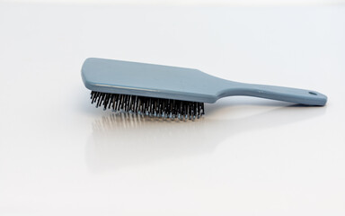 Hair brush comb closeup view on white background