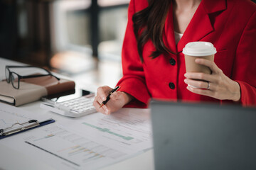 Company finance staff preparing financial documents, company finance staff preparing company...