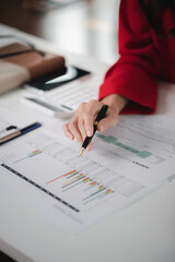 Naklejka premium Company finance staff preparing financial documents, company finance staff preparing company finance documents to bring to the meeting to summarize for management's acknowledgment. Financial concept.