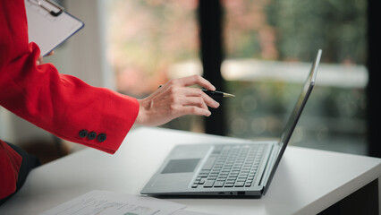 Company finance staff preparing financial documents, company finance staff preparing company...