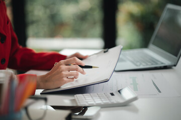 Company finance staff preparing financial documents, company finance staff preparing company...