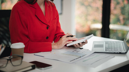 Company finance staff preparing financial documents, company finance staff preparing company...