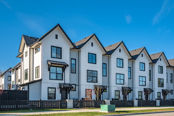 Obraz premium New residential townhouses. Modern apartment buildings in Canada. Modern complex of apartment buildings
