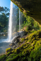 Vertical landscape of Misol Ha waterfall at sunset, Chiapas, Mexico.