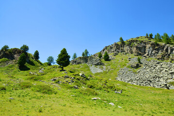 Fototapeta na wymiar Gran Paradiso National Park. Valle di Bardoney, Aosta Valley, Italy. Beautiful mountain landscape in sunny day.