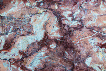  Fragment of a marble slab with veins of brown and gray shades