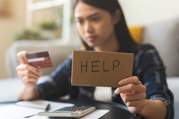 Business financial concept, stressed asian young business woman desperate suffering asking for help accounting of credit card for payment on due deadline, trying to find money to pay credit card debt