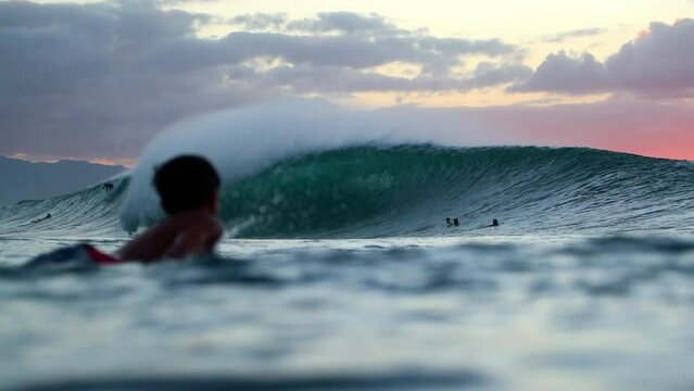 Slow Motion Shot Of Tourists Swimming With Surfboard On Ocean During Sunset - Waikiki, Hawaii