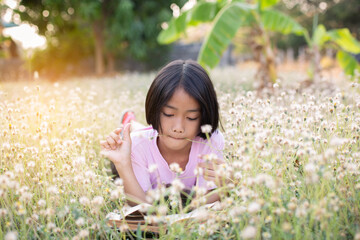 child little girl with  reading a books