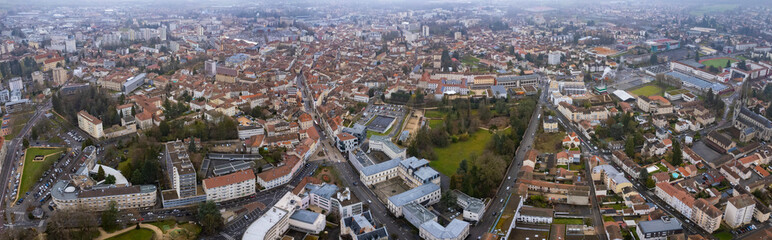 Fototapeta na wymiar Aerial around the city Bourg-en-Bresse on a cloudy afternoon in early spring in France