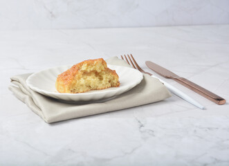 gourmet freshly bake golden Texas sweet original honey biscuit bun cake scone milk butter bread in square bento wood box on white marble table rose gold fork knife pastry halal dessert vegan menu