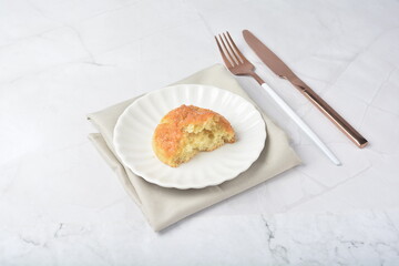 gourmet freshly bake golden Texas sweet original honey biscuit bun cake scone milk butter bread in square bento wood box on white marble table rose gold fork knife pastry halal dessert vegan menu