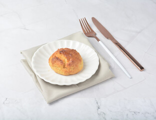 gourmet freshly bake golden Texas sweet original honey biscuit bun cake scone milk butter bread in square bento wood box on white marble table rose gold fork knife pastry halal dessert vegan menu