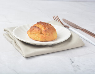 gourmet freshly bake golden Texas sweet original honey biscuit bun cake scone milk butter bread in square bento wood box on white marble table rose gold fork knife pastry halal dessert vegan menu