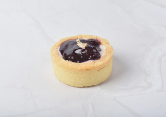 mini bake cute crisp creamtart with colourful flavour like chocolate coffee walnut, golden blueberry, strawberry osmanthus, mango vanilla in crystal plastic box on white marble pastry halal party menu