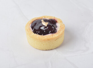 mini bake cute crisp creamtart with colourful flavour like chocolate coffee walnut, golden blueberry, strawberry osmanthus, mango vanilla in crystal plastic box on white marble pastry halal party menu