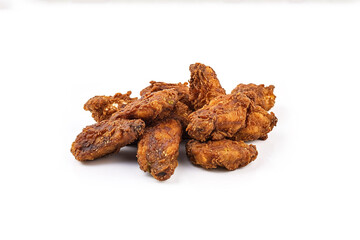 a pile of spicy fried chicken wings isolated on a white background. Created with Generative AI Technology