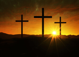 Crucifixion of Jesus Christ at dawn - three crosses on the hill at sunset.