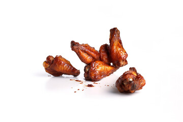 a pile of spicy fried chicken wings isolated on a white background. Created with Generative AI Technology