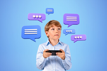 School boy holding phone and looking up at text bubbles and messages