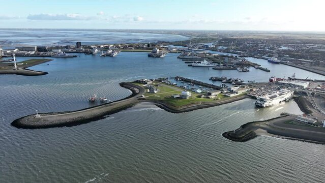 A stunning aerial drone video capturing the beauty and vitality of Den Helder harbour, from its charming canals to its bustling docks.