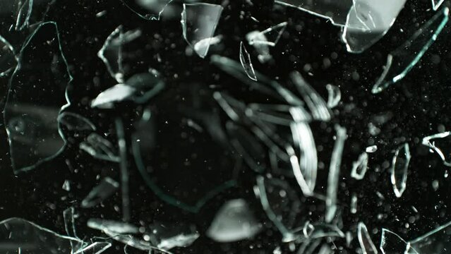 Super Slow Motion Shot of Breaking Real Glass at 1000 fps. Isolated on Black Background.
