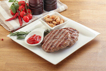 Grilled beef burger cutlet with sauce