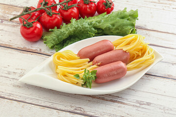 Mini sausages with pasta spaghetti