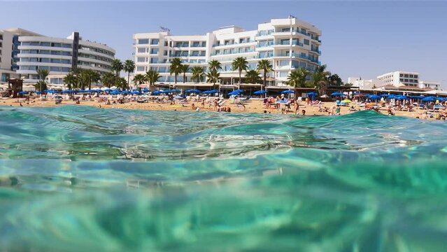 View of the beach and the line of hotels in Protaras Cyprus from the water level
