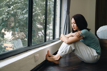 Young Asian woman at home - Powered by Adobe