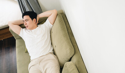 Image of young Asian man at home