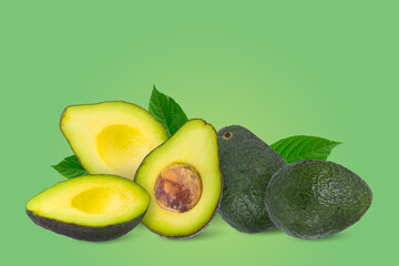 Green ripe avocado isolated on a green background. Fruit minimal concept and copy space.