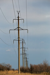 Pylon and transmission power line in sunset