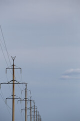 Pylon and transmission power line in sunset