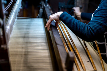 Van Phuc silk weaving village, Ha Noi, Viet Nam - Close-up picture of silk weaving machine in Van Phuc village. Van Phuc village is famous for the traditional silk weaving village