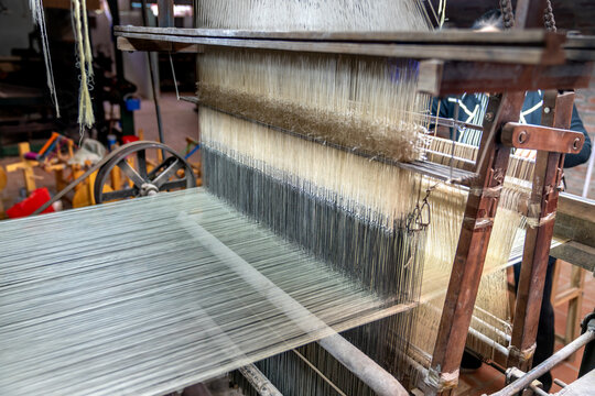 Van Phuc silk weaving village, Ha Noi, Viet Nam - Close-up picture of silk weaving machine in Van Phuc village. Van Phuc village is famous for the traditional silk weaving village