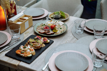 Festive table served with meat dishes and salads