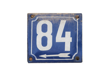 Weathered grunge square metal enameled plate of number of street address with number 84 isolated on...